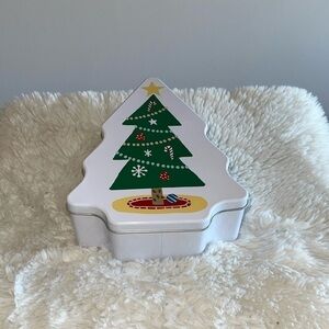 Storage container with a Xmas tree in the front and shape made of metal